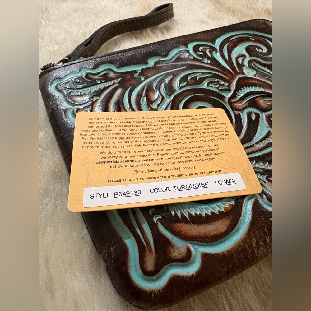Patricia Nash Cassini Wristlet
Tooled Turquoise - Picture 2 of 8